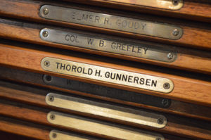 Wooden base with metal plaque that says Thorold H. Gunnersen