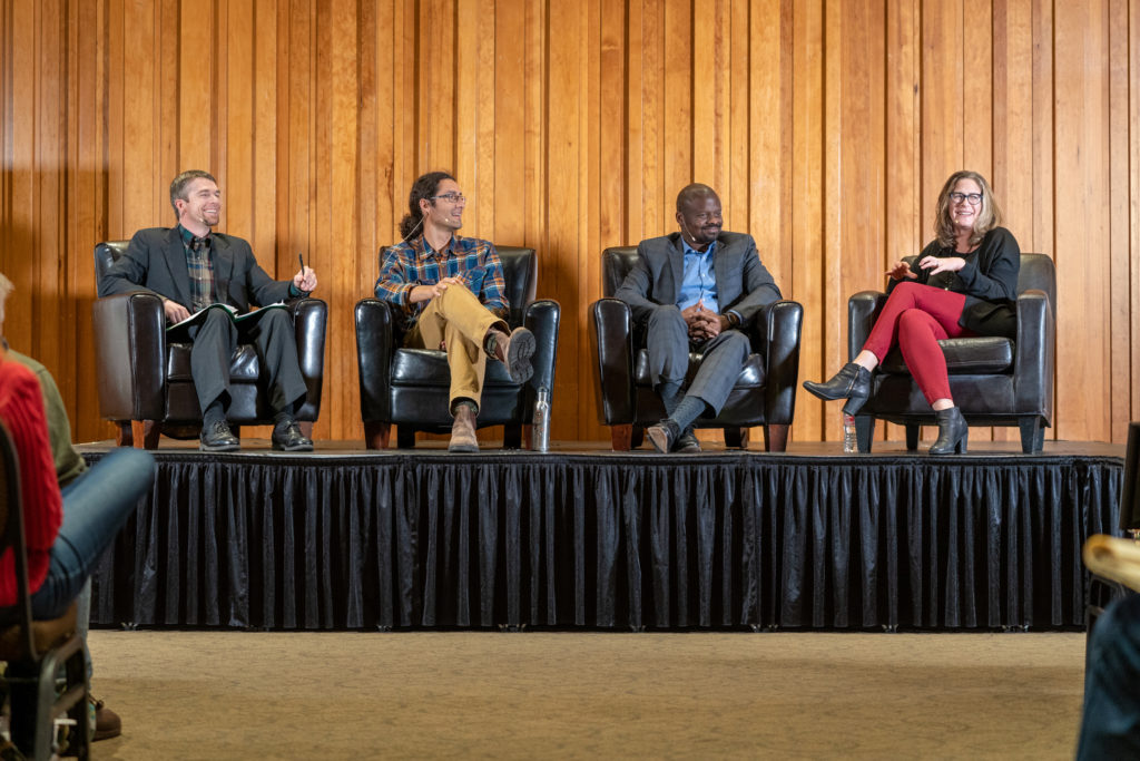 Four panelists on stage at the Hagenstein Lecture