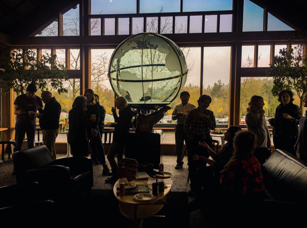People gather in a room inside of World Forestry Center