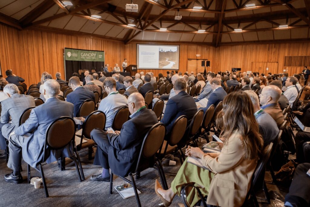 A speaker in a conference room.