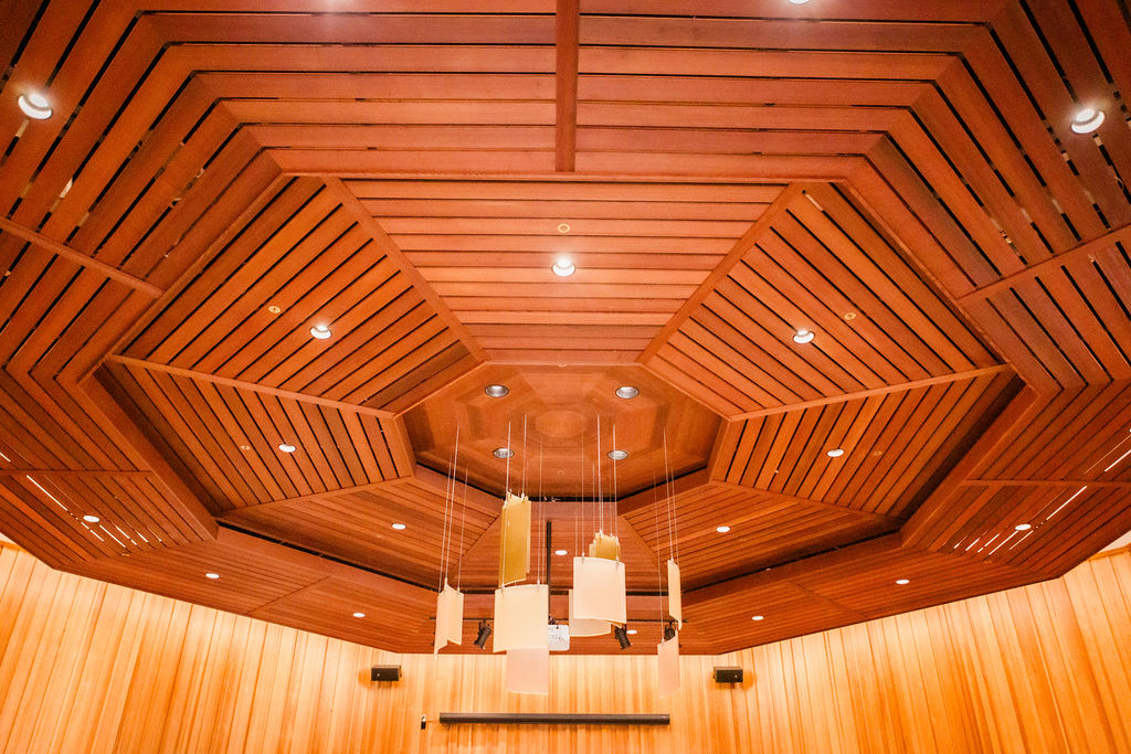 art_hanging_from_wood_ceiling