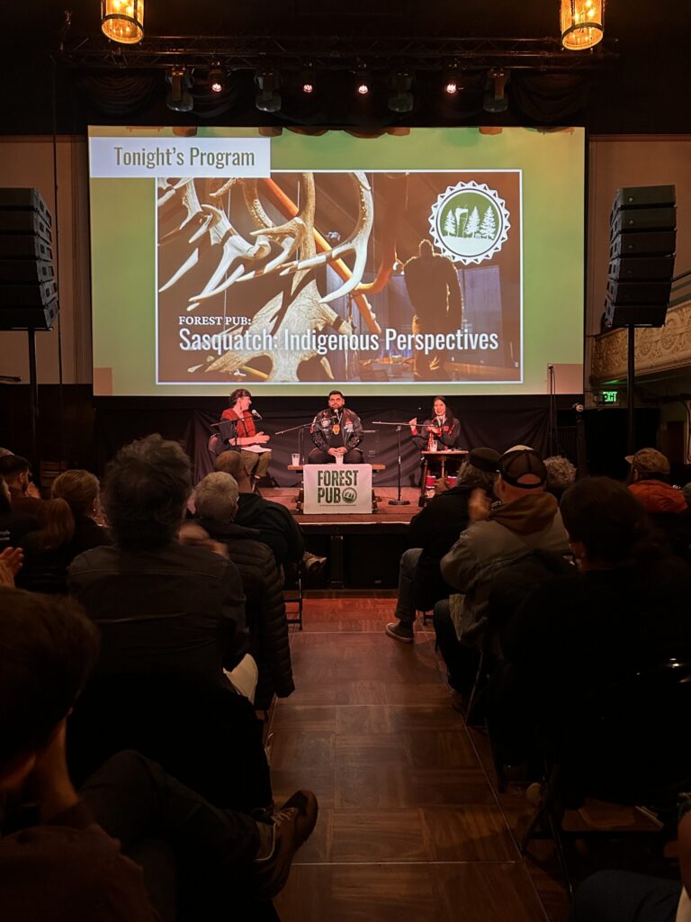 A speaker in a conference room.