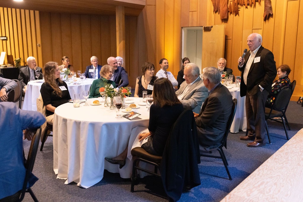 A speaker in a conference room.