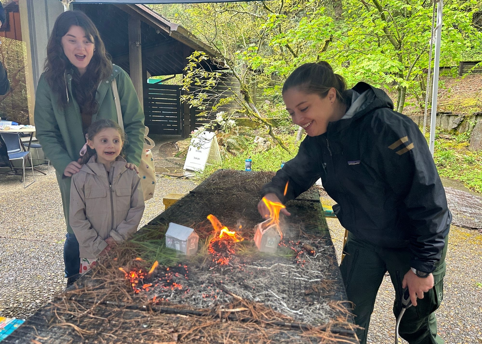 mother_daughter_at_table_with_fire_simulator
