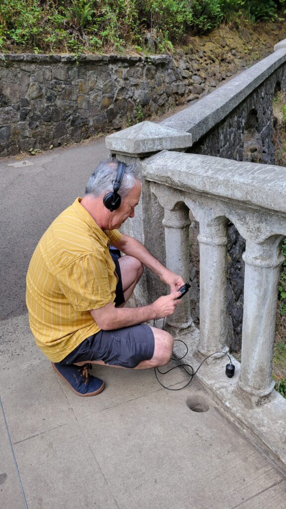 person_listening_to_forest_sound_walk_recording
